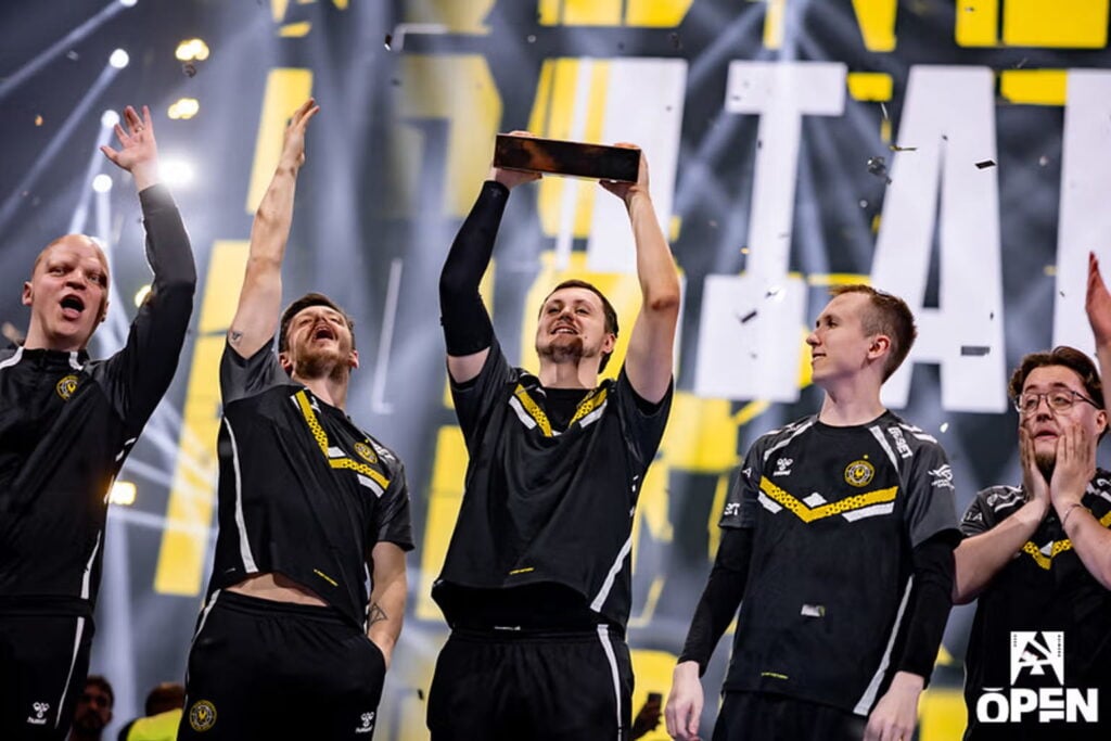 Team Vitality celebrate as mezii lift the trophy after winning a BLAST Open tournament.