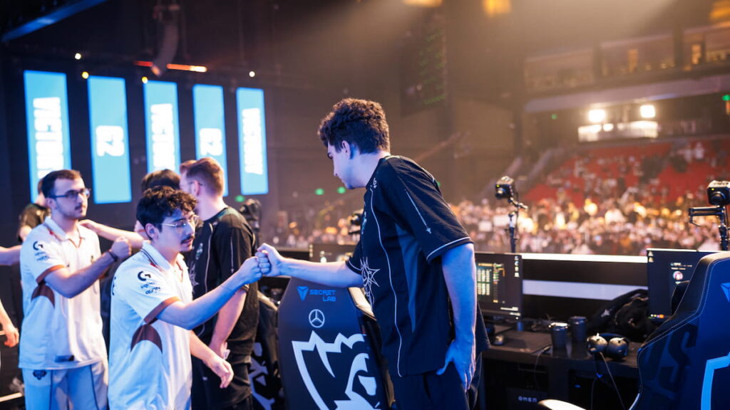 BrokenBlade of G2 Esports and Bwipo of FlyQuest fist bump onstage at League of Legends Worlds 2025 Swiss Stage on October 22, 2025 in Beijing, China.