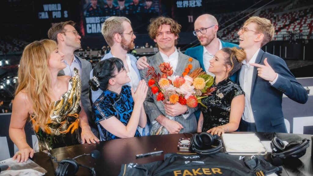 Esports host Sjokz, caster Drakos, Chronicler, Laure, Kobe, Emily Rand, Azael and Vedius pose from the analyst desk at League of Legends Worlds 2025 Finals on November 08, 2025 in Chengdu, China.