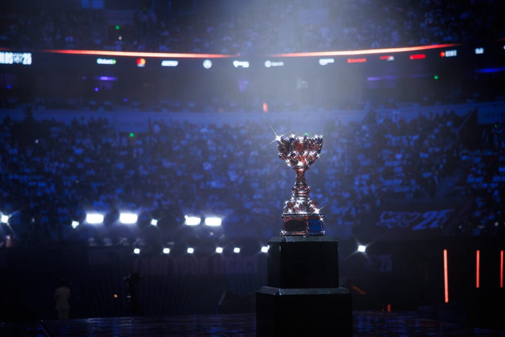 League of Legends Worlds 2025 trophy captured with the crowd in the background