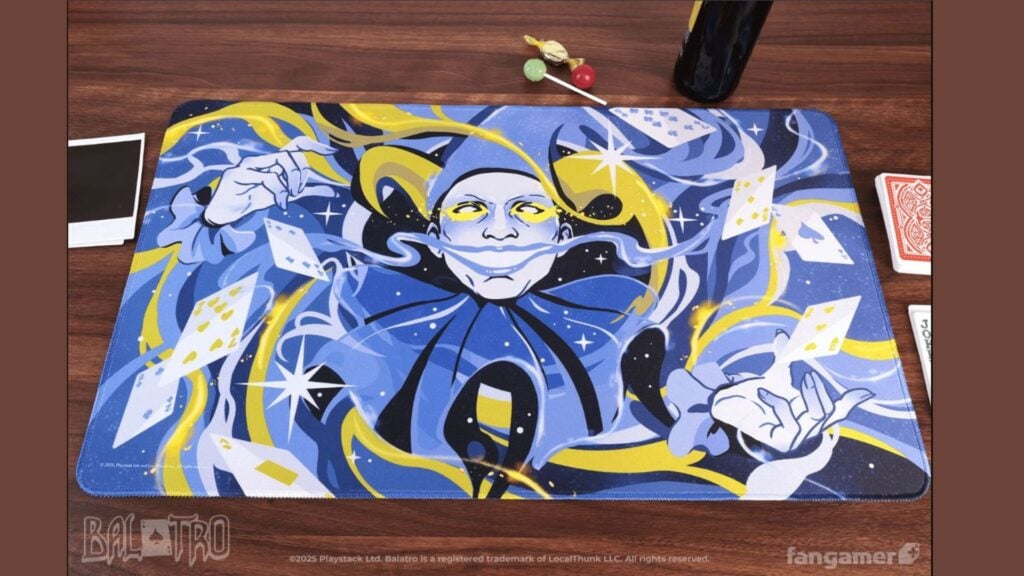A desk mat with art from Balatro