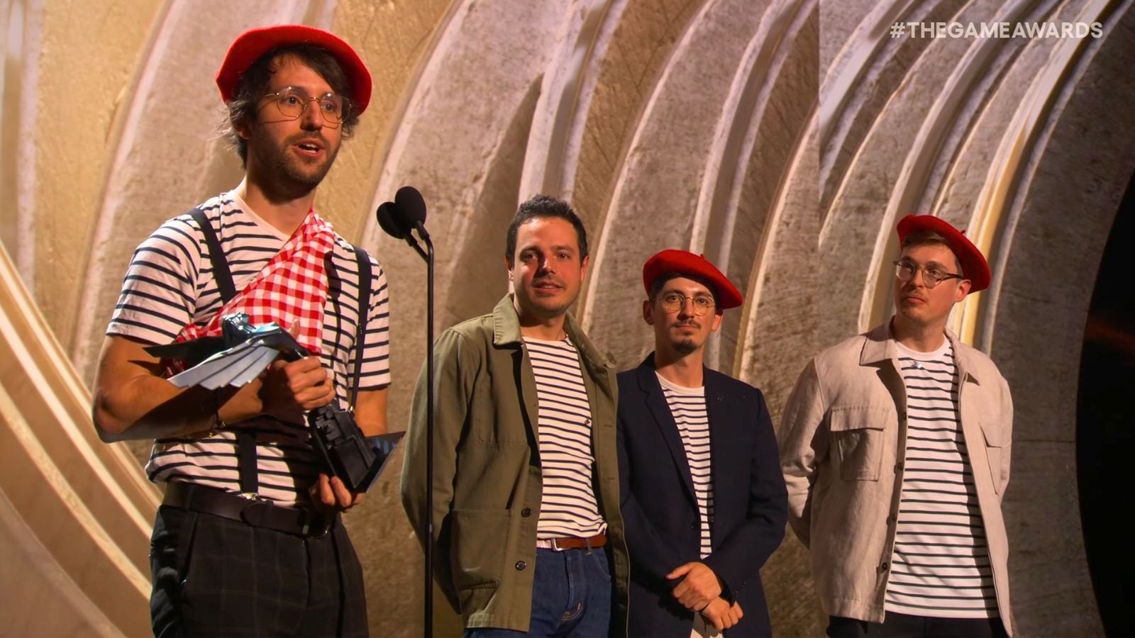 Guillaume Broche and other Sandfall Interactive executives receive the Game of The Year Award at The Game Awards 2025