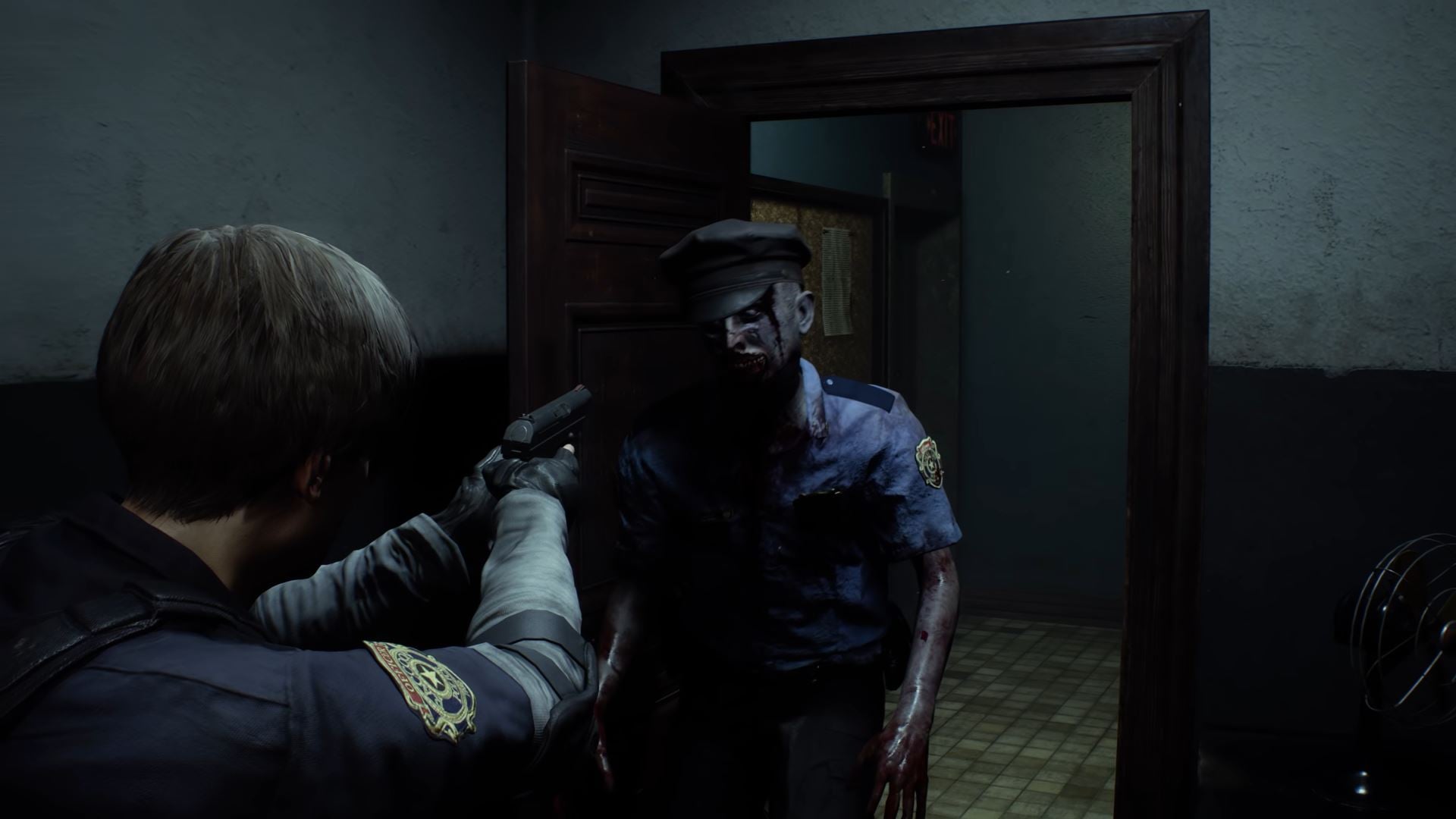 A zombie cop attacking Leon in Resident Evil 2